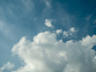 White clouds in the blue sky.