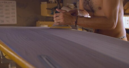 Leveling Surfboard Surface With A Surfboard Sander. static - Powered by Adobe