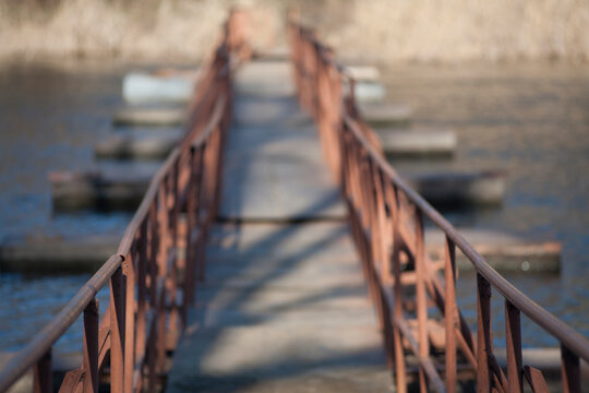 Iron railing of the bridge across the river.