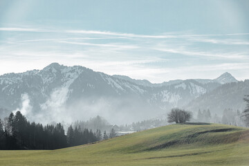 landscape with mountains fog and clouds