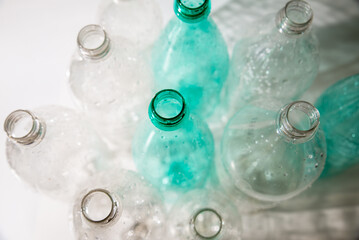 several empty plastic bottles with water drops. ecology, recycling