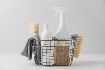 Set of detergents In basket. Cleaning agent, rag, sponge, brushes. Cleaning service concept