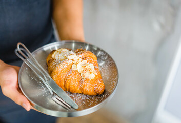Fresh France plane croissant on bakery restaurant cafe coffee wooden table.restaurant bakery menu.dessert.bakery shop, baked croissant.Homemade croissants on bakery cafe.Dessert breakfast in France.