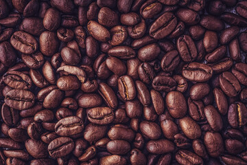 Roasted coffee beans background. Selective focus