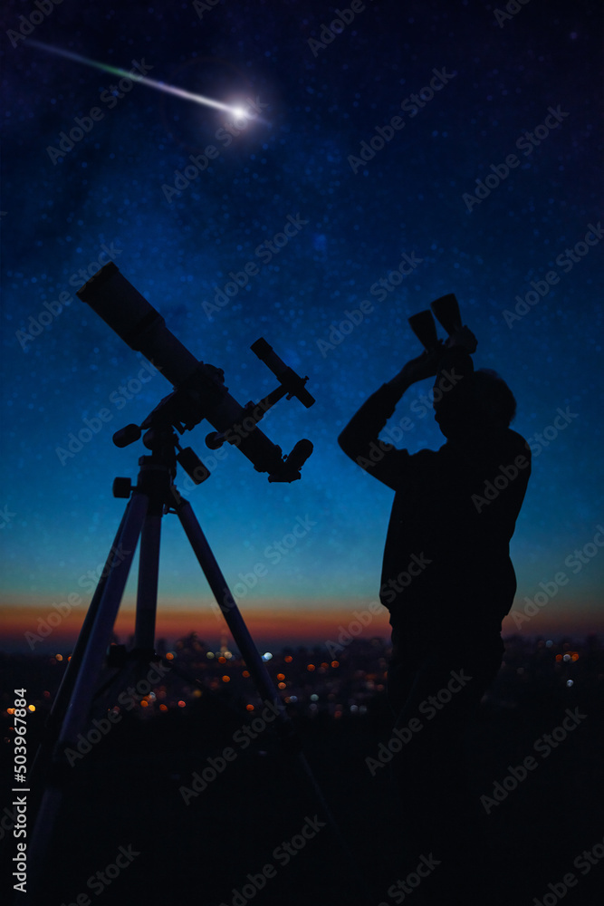 Canvas Prints silhouette of a man while watching starry skies with astronomy telescope and binoculars.