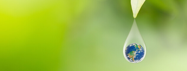 Earth in water drop under green leaf, International Earth Day and World Environment Day Concept, Elements of this image furnished by NASA