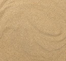 Nahaufnahme der Sandstruktur. Brauner Sand. Hintergrund aus feinem Sand.