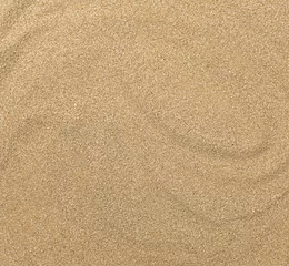 Foto op Plexiglas Sluit omhoog van zandtextuur. Bruin zand. Achtergrond van fijn zand. © Albert Ziganshin