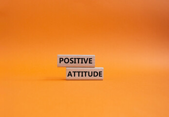 Positive attitude symbol. Concept words Positive attitude on wooden blocks. Beautiful orange...