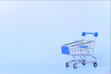 blue shopping cart with blue background