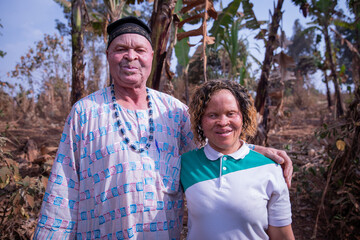 Portrait of an African father and daughter suffering from albinism, people with little melanin in...