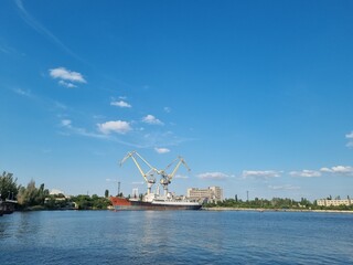 Fototapeta na wymiar Mykolaiv, Ukraine - . September 4, 2021. Cranes in the port where ships can be repaired. View from the riverside