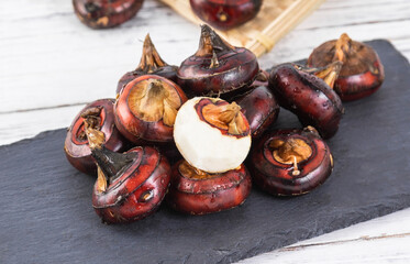 Vegetable water chestnuts on a white background
