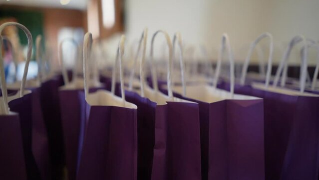 A bunch of gift bags in a party.