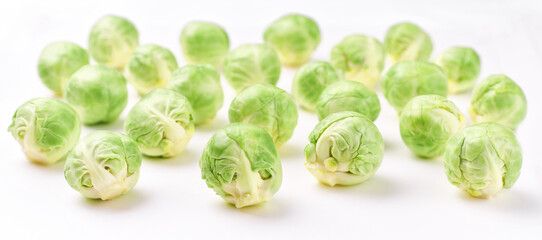 Fresh brussels cabbage on a white background.