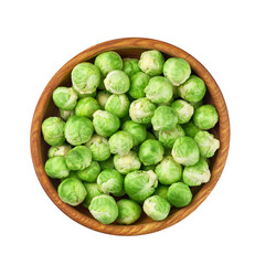 fresh brussel sprouts in a wooden bowl isolated on white background, top view.