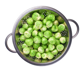 Brussels sprouts in metal bowl isolated on white background, top view.