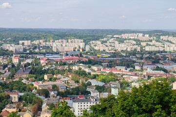 Fototapeta na wymiar Panoramic view of Lviv from the mountain in the center. Residential part of the city with houses
