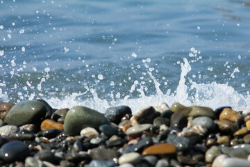 shingle and foam with splashes of water