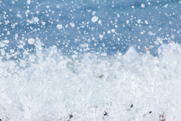 Sea foam with water splashes and drops background