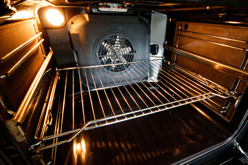 Open oven with forced draft fan and lighting.