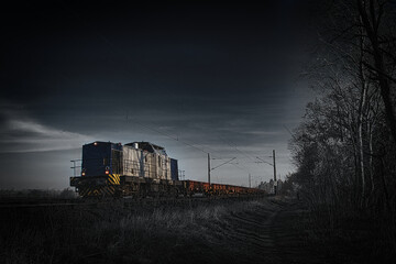 Obraz na płótnie Canvas Zug in der Dämmerung - Freight Train -High quality photo - Ecology - Cargo