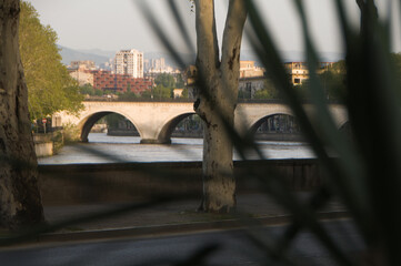 old bridge over the river at dawn