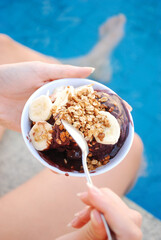 Eating Brazilian açai in the swimmingpool