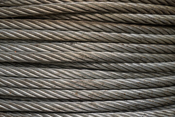 Close-up of Coil large Wire rope sling or Cable sling drum reels stocked in store. Steel wire cable...