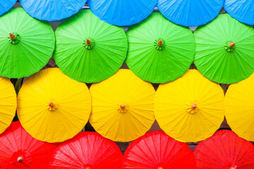 Fototapeta na wymiar Chiangmai - THAILAND , December 1,2021 : Colorful handmade umbrellas at Chiangmai ,lanna style.