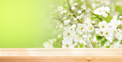 Empty wooden table for product demonstration and presentation against the backdrop of spring...