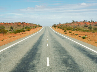 Fototapeta na wymiar long Australian road in the middle of nowhere - Australia - streets