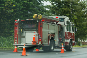 Fire engine racing down road through construction site