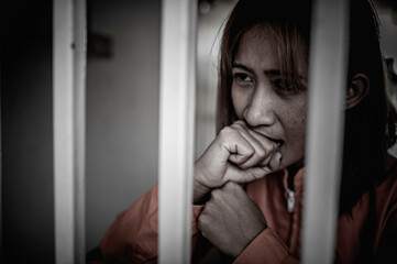 Fototapeta na wymiar Hands of women desperate to catch the iron prison,prisoner concept,thailand people,Hope to be free,If the violate the law would be arrested and jailed.