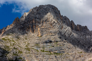 Mountain above Lake Sorapis, azure blue lake in the dolomites, Italy