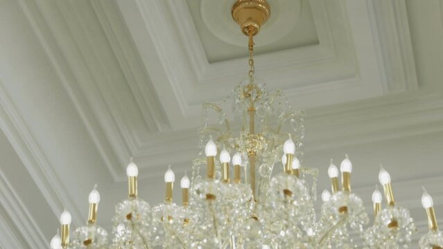 large chandelier with a lot of light bulbs close-up