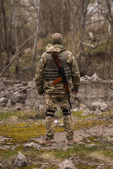 Ukrainian soldier in uniform turned his back - 503994076