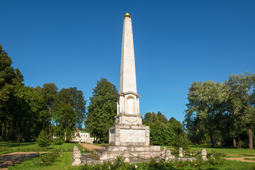Fototapeta na wymiar Village of Stepanovskoe-Volosovo. Russia, Tver region. Monument obelisk to Emperor Alexander 1 in the park of the estate