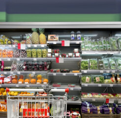 buying vegetables and fruits  at the market.empty grocery cart in an empty supermarket