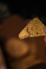 Nacho chips with cheddar cheese sauce for dipping snack mexican food style tex-mex