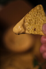 Nacho chips with cheddar cheese sauce for dipping snack mexican food style tex-mex