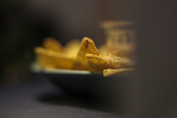 Nacho chips with cheddar cheese sauce for dipping snack mexican food style tex-mex