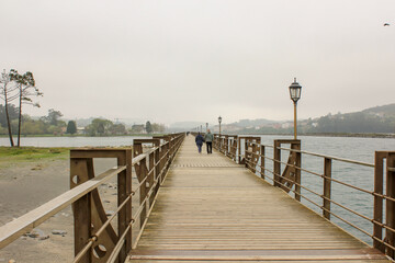 Naklejka premium wooden bridge over the lake