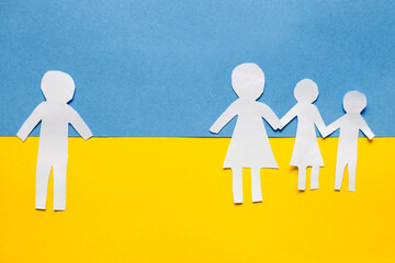 paper cut divided family on the background of the ukrainian flag. stop war concept - obrazy, fototapety, plakaty