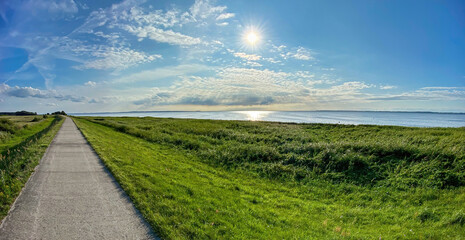 Straight walking path to Ummanz island during summer