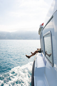 Boating in the sea, the concept of enjoying a vacation, sea fishing, nature. Vertical photo.