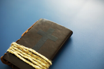 Book with the symbol of the cross. Bible study. Religious book. Prayer.