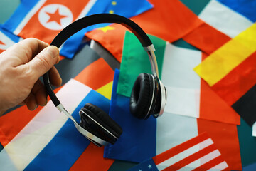 Headphones and flag. The study of foreign subjects. Audiobooks in a foreign language. Language...