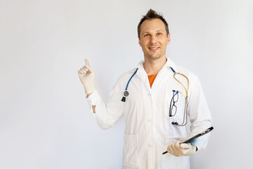 Middle aged man doctor, medical professional holding something in empty hand, isolated on white background