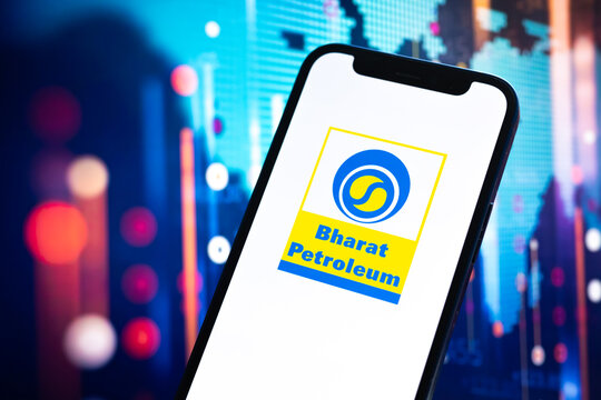 Index of Bharat Petroleum oil prices, logo close-up. Stock market graphs, global financial background. Gasoline, energy and diesel industry concept